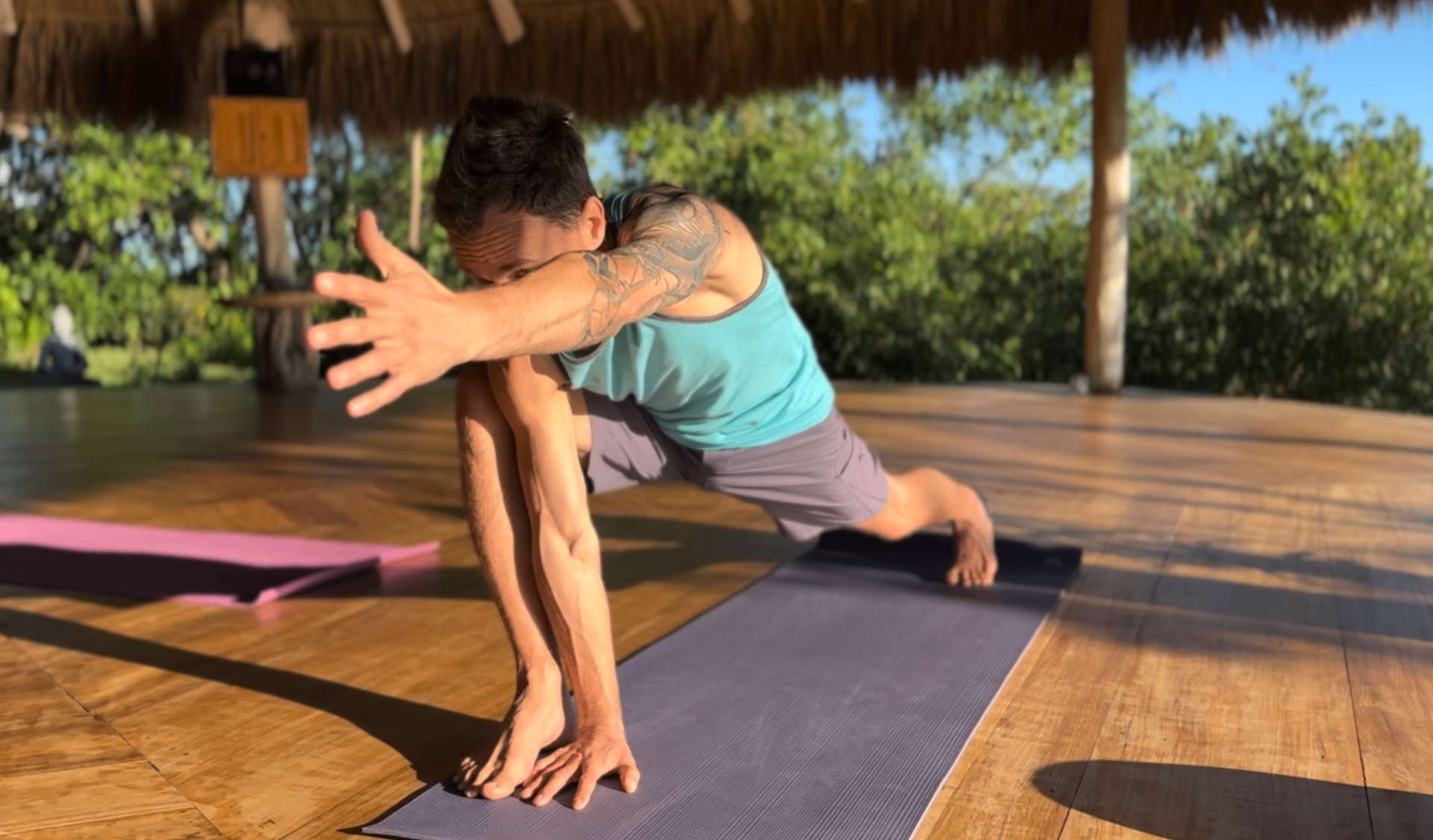Jonathan in movement practice, open-air pavilion, Costa Rica